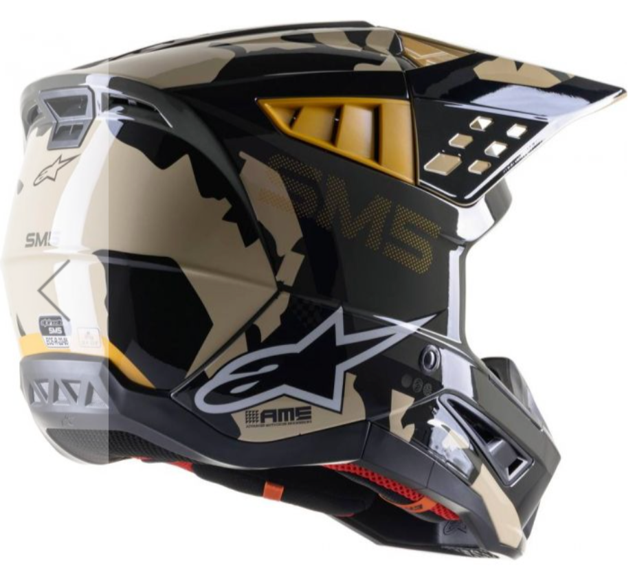 Alpinestars AMS SM5 motocross helmet in a glossy black, beige, and gold camouflage pattern, shown from a side profile view against a white background.