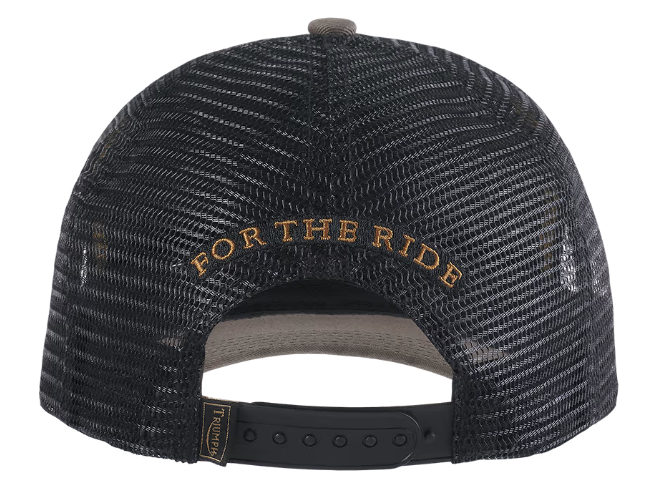 Rear view of a black trucker hat with a black mesh back, gold embroidered 'FOR THE RIDE' text, and a black adjustable strap.