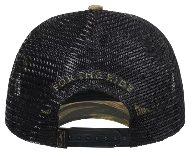 Back view of a black trucker-style baseball cap with a camouflage-patterned visor underside and adjustable black snapback strap. The back panel has 'FOR THE RIDE' embroidered in a muted olive-gold tone, and a small brand patch is visible on the strap.